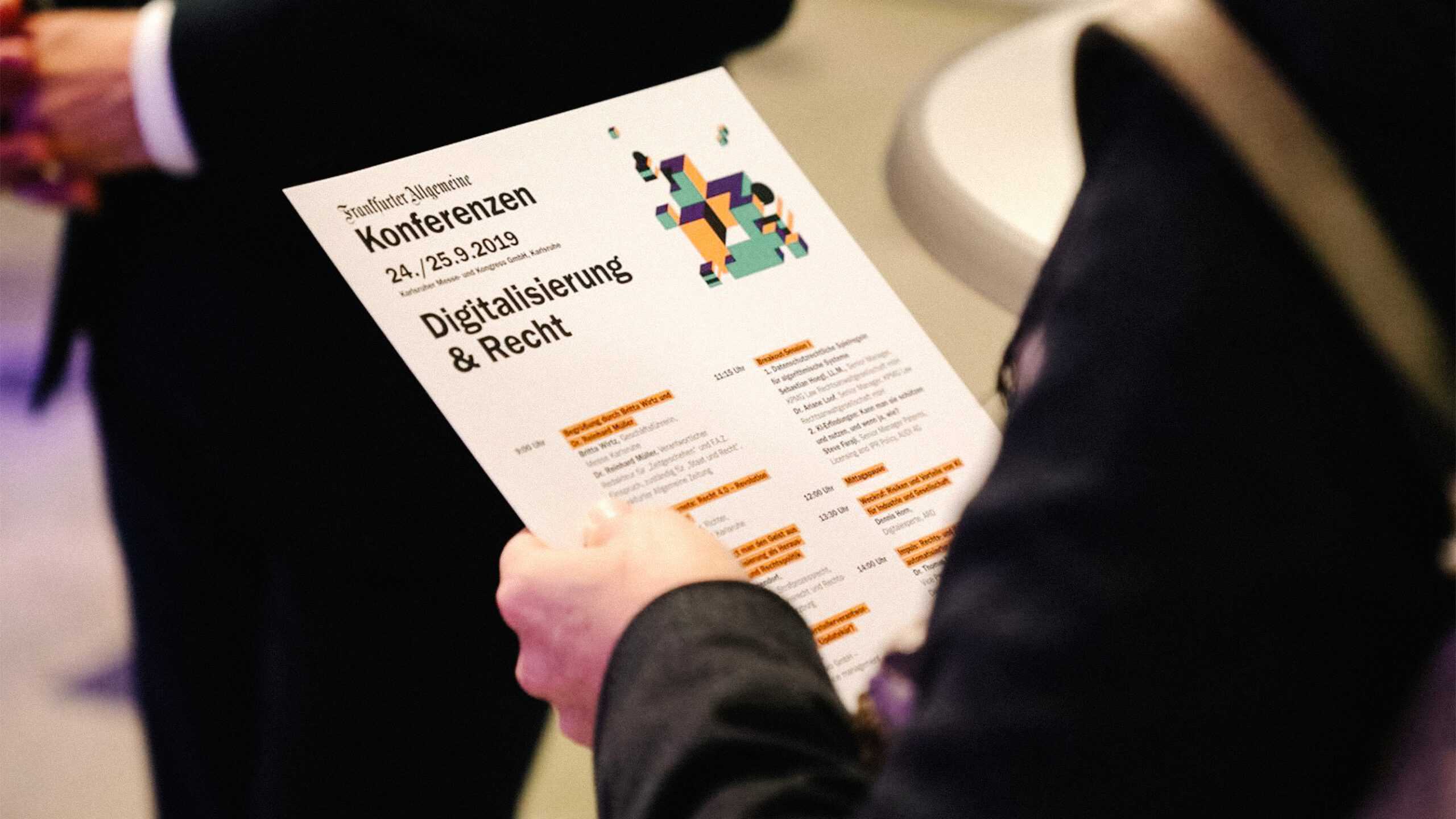 image of person reading a faz conferences program