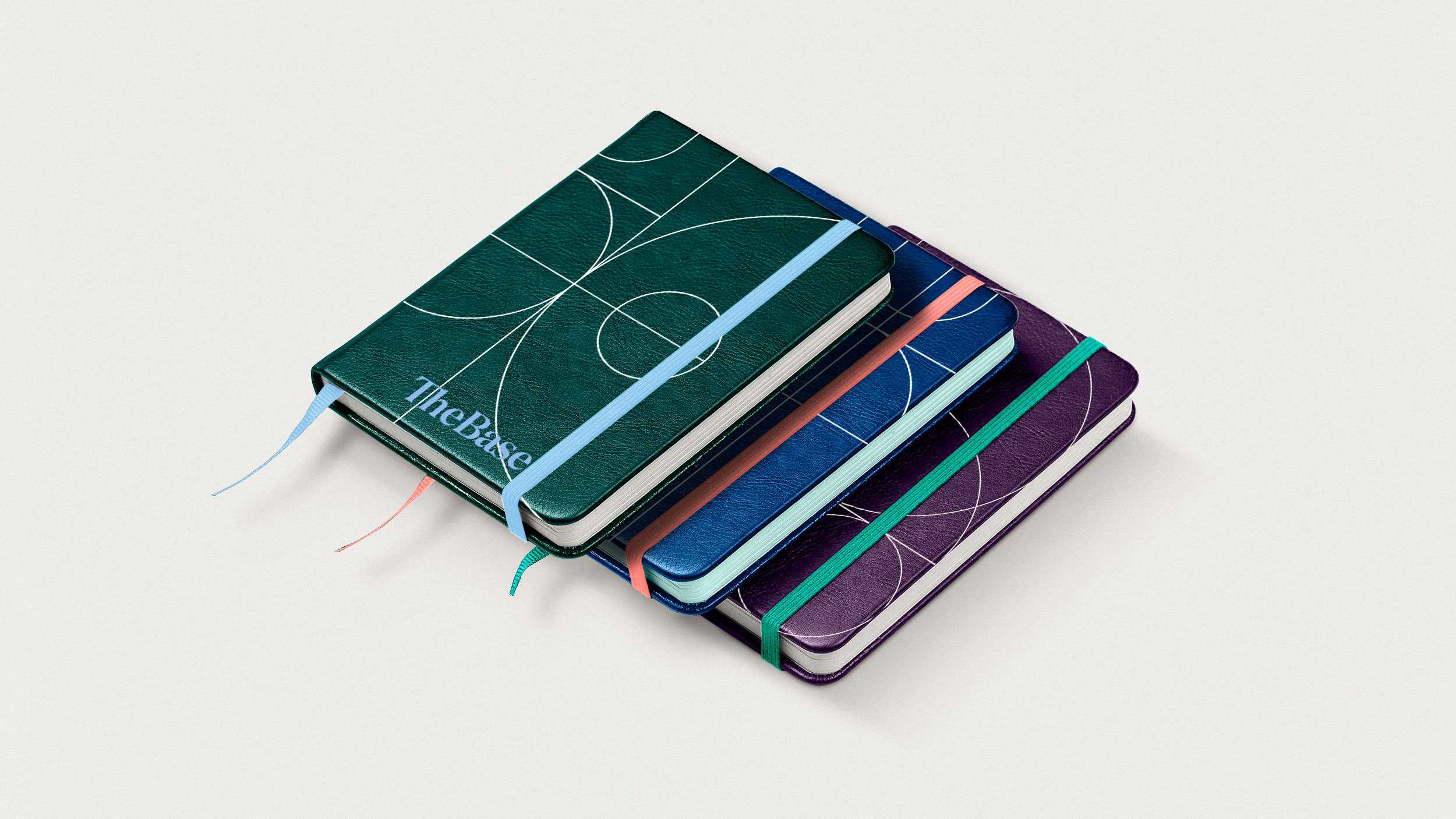 Notebooks with The Base logo and pattern